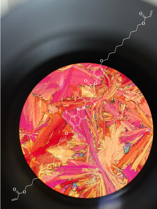 Polarized optical microscopy image of an azobenzene-based polymer material with molecular structures